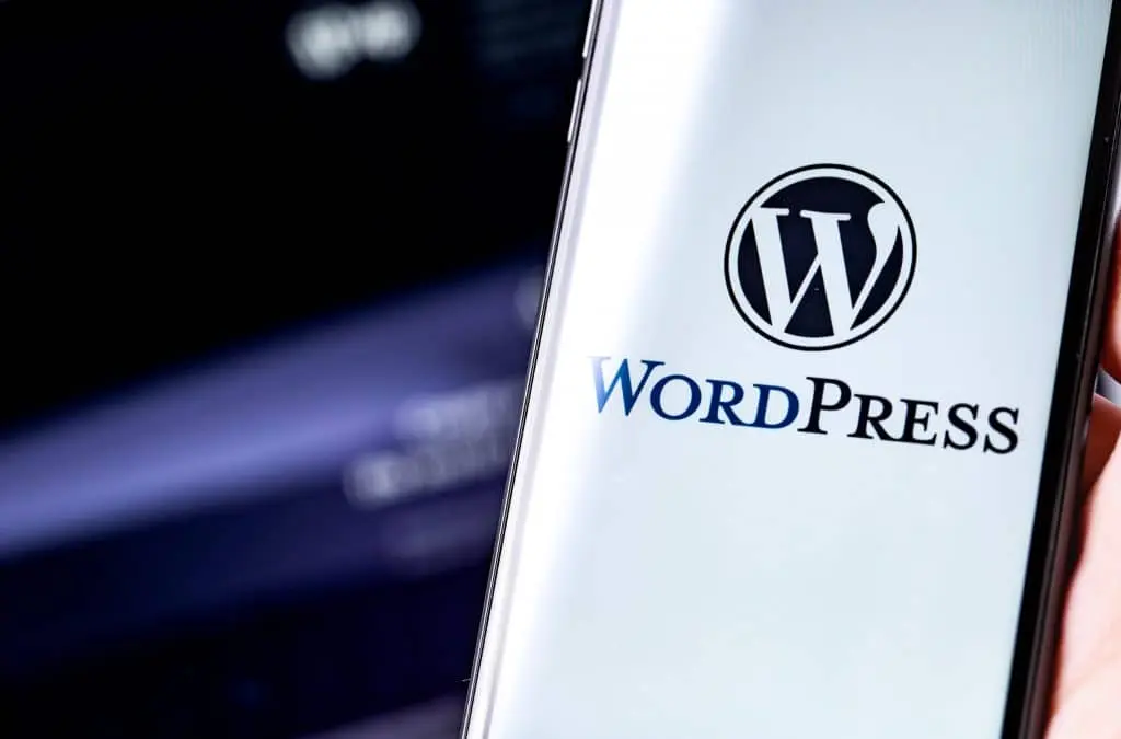 WordPress logo on the screen smartphone and notebook background Wordpress Headless